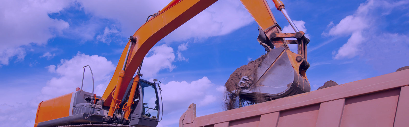 Construction site with dirt being loaded into a truck