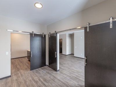 Apartment Dining Area with Barn Doors at Velocity Apartments