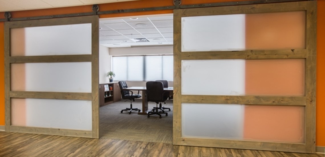 Sliding Barn Door Entry to Conference Room at Integral Building Systems
